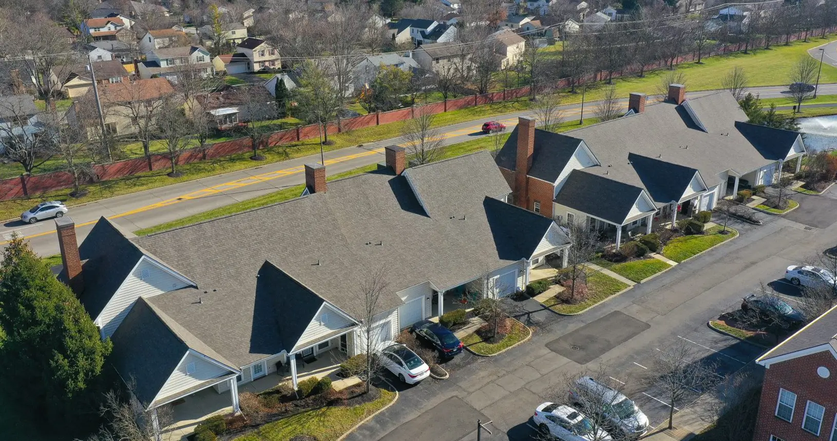 Aerial view of multi-family units with new shingle commercial roofing at the Times Square Apartments in Dublin, Ohio.